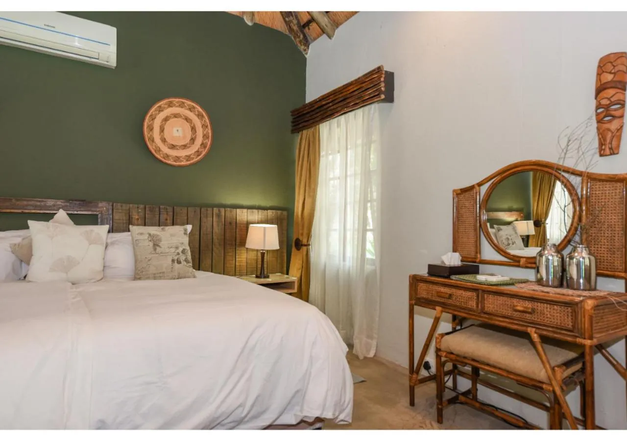 Bed in Mziki Safari Lodge