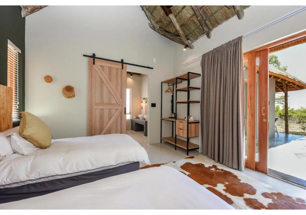 Bed in Mziki Safari Lodge