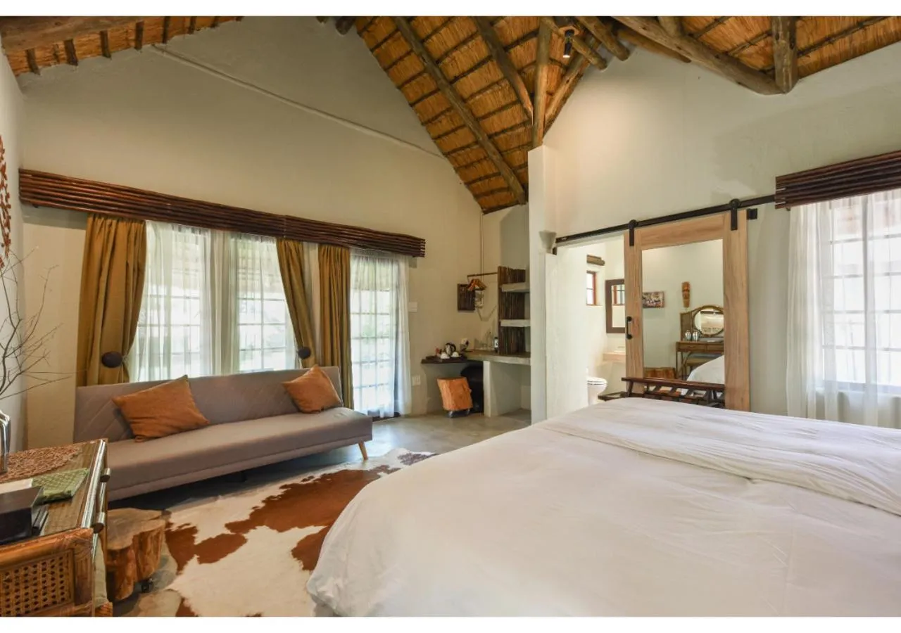 Bed in Mziki Safari Lodge