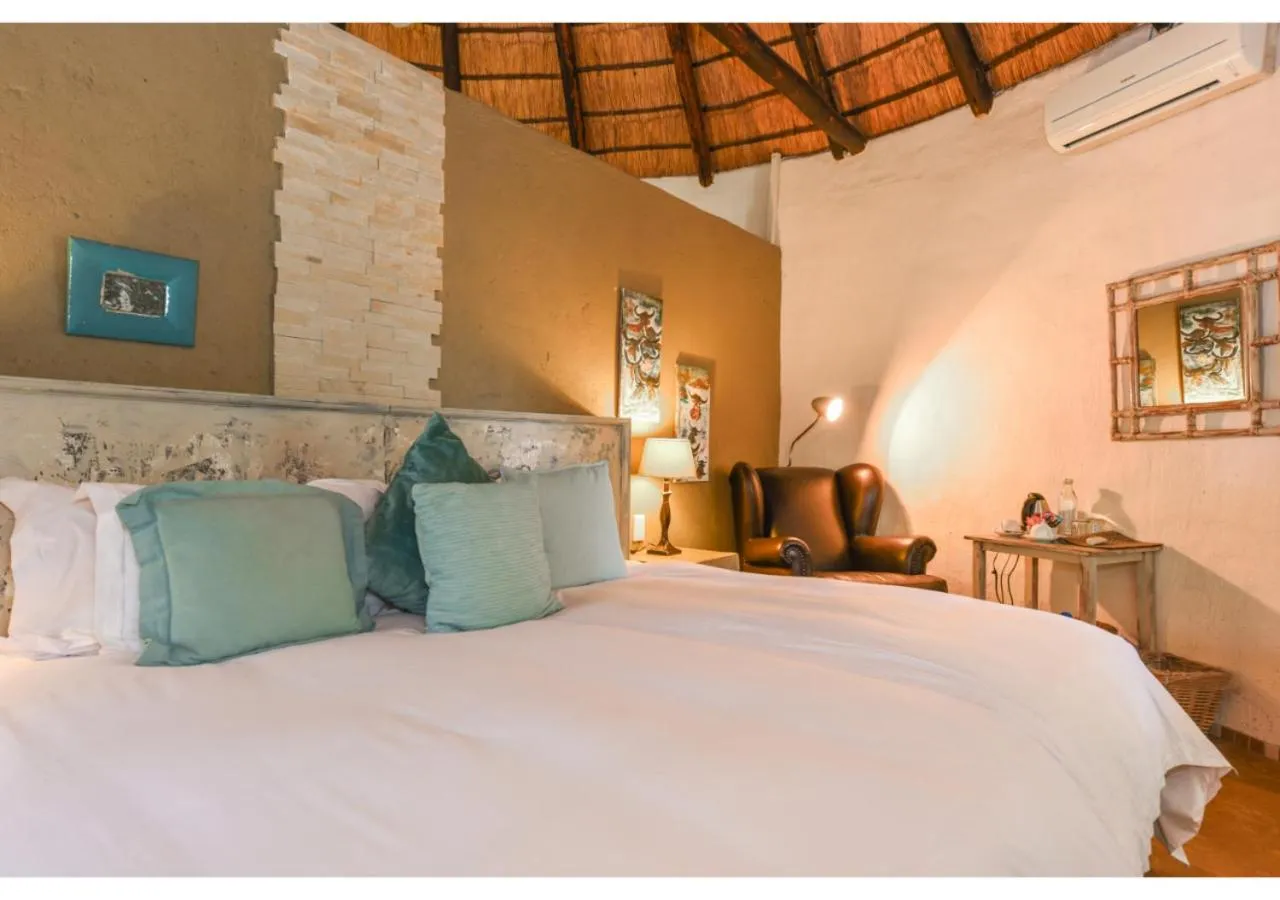 Bed in Mziki Safari Lodge