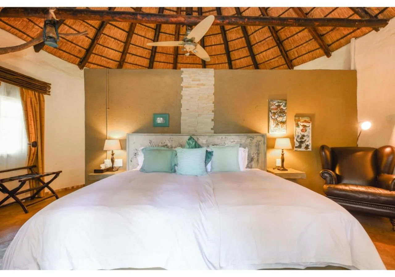 Bed in Mziki Safari Lodge