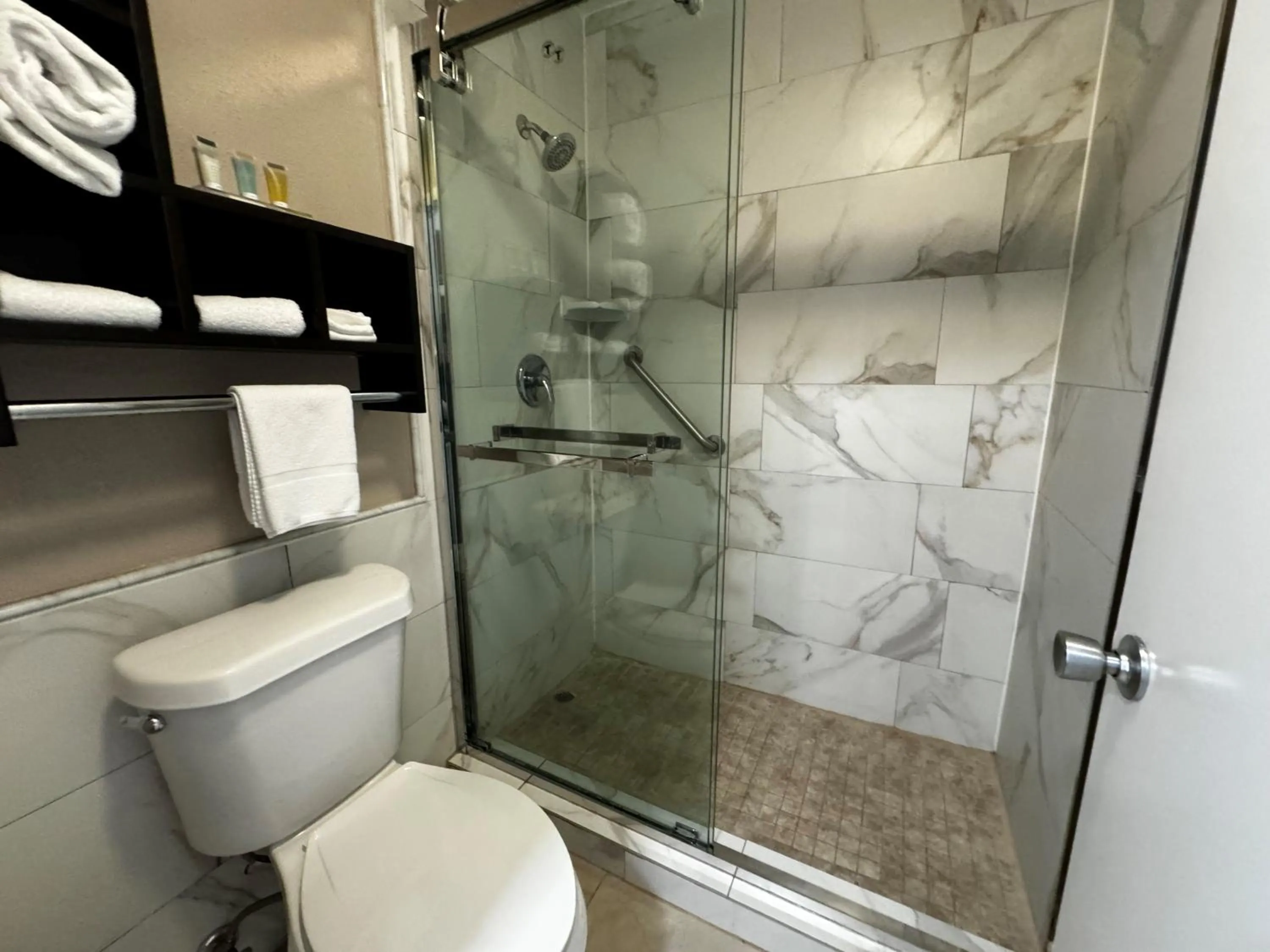 Toilet in Super 8 by Wyndham Houston Webster NASA