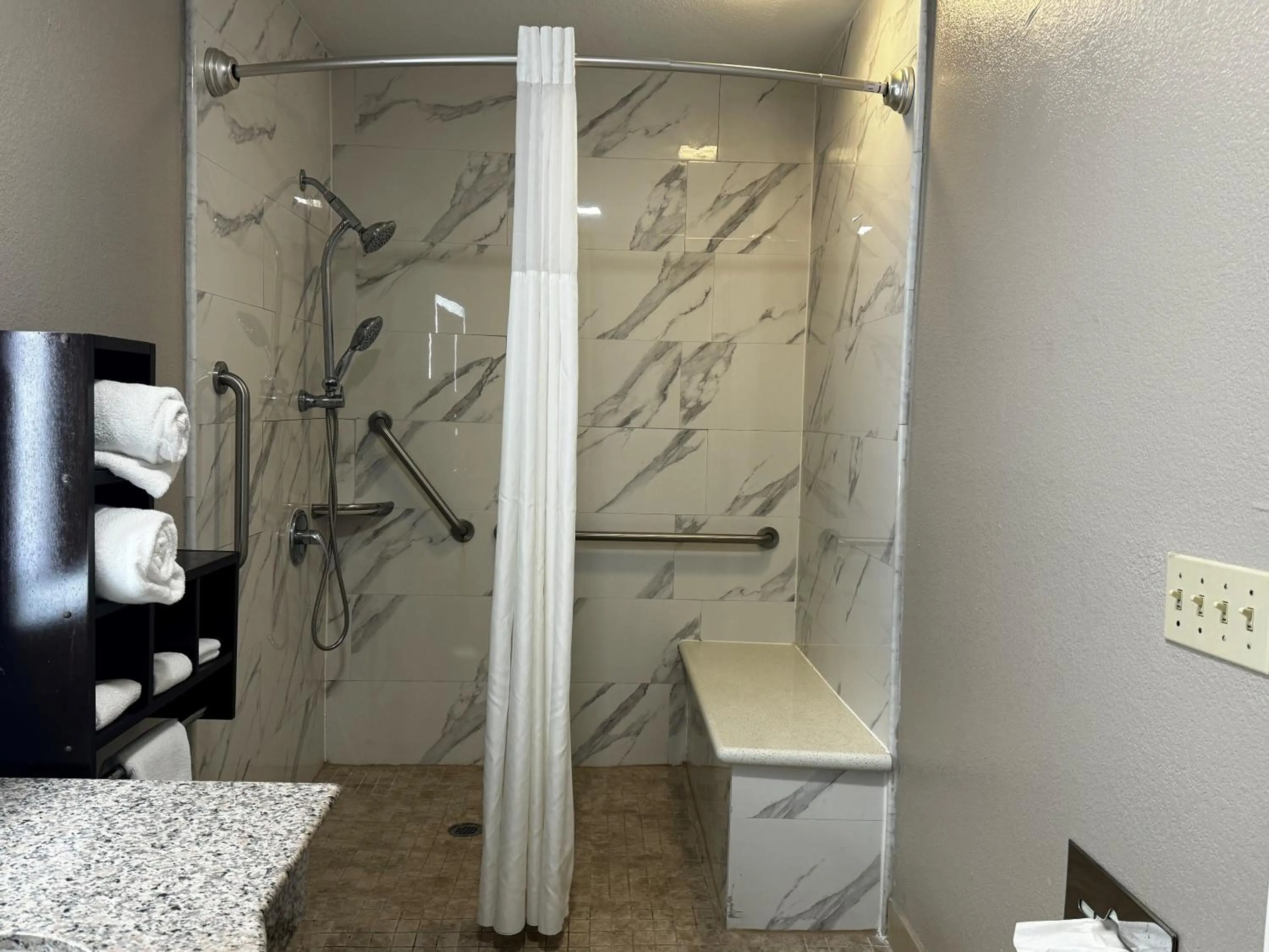 Bathroom in Super 8 by Wyndham Houston Webster NASA