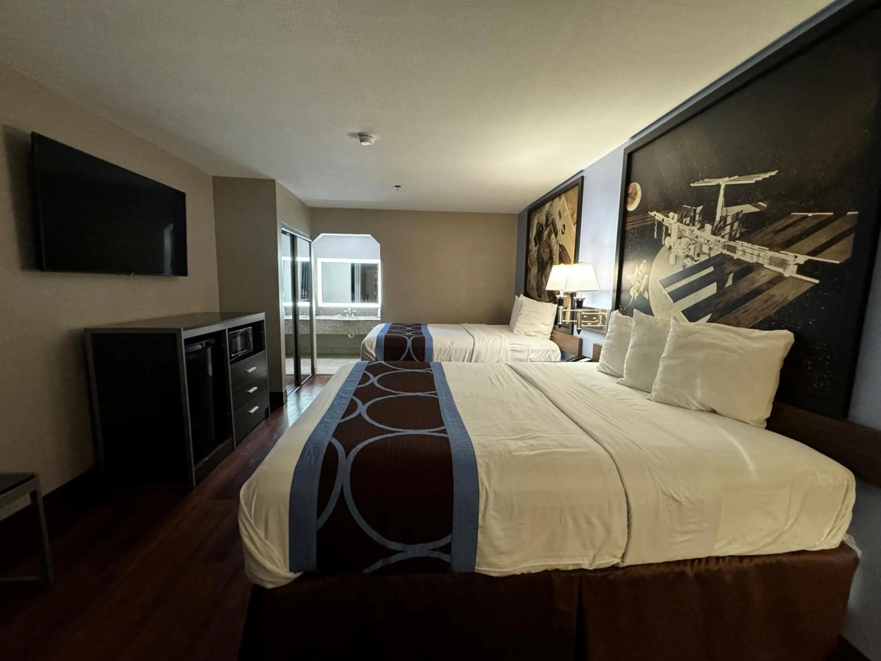 Bed in Super 8 by Wyndham Houston Webster NASA