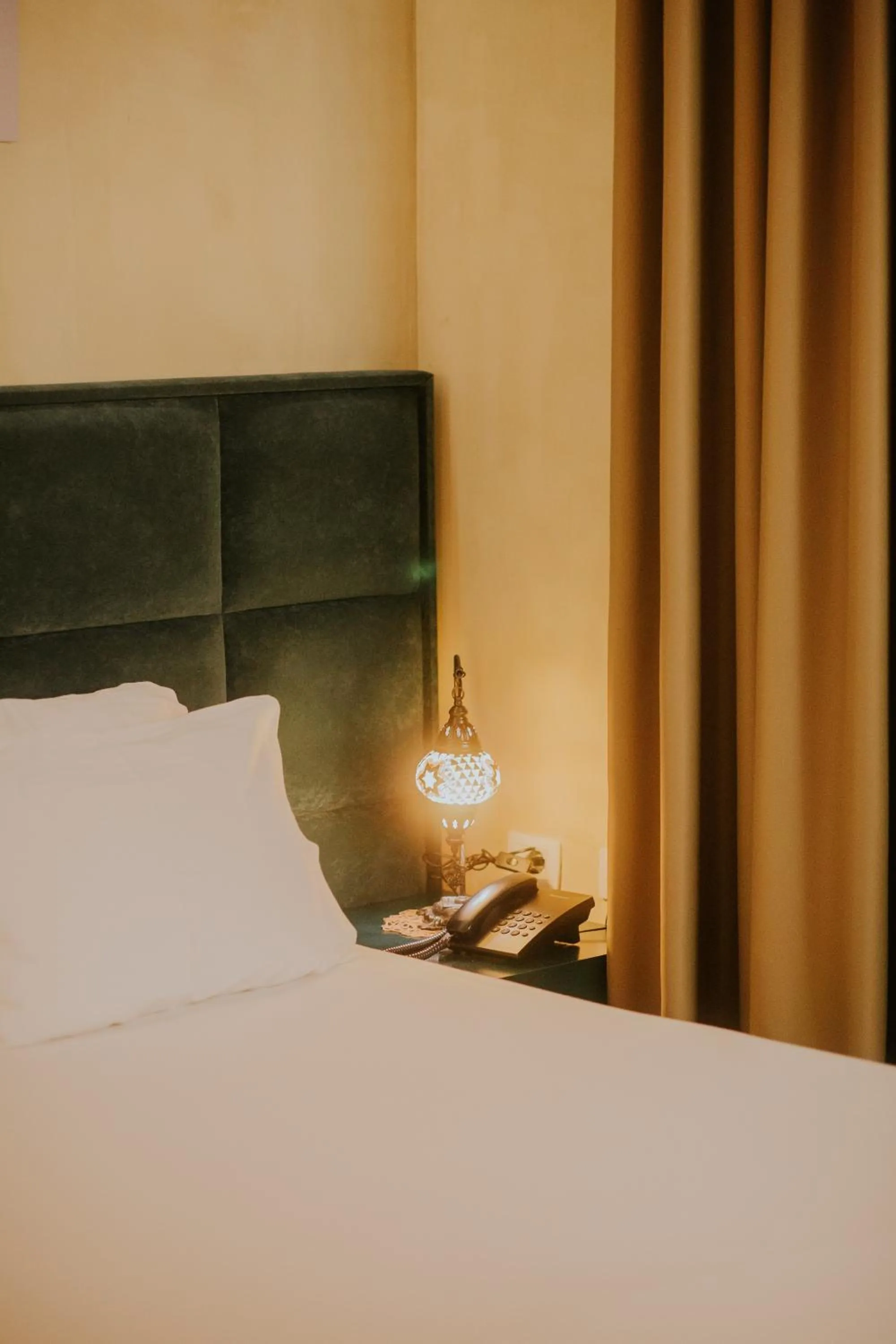 Bed in Dim's Hotel & Restaurant