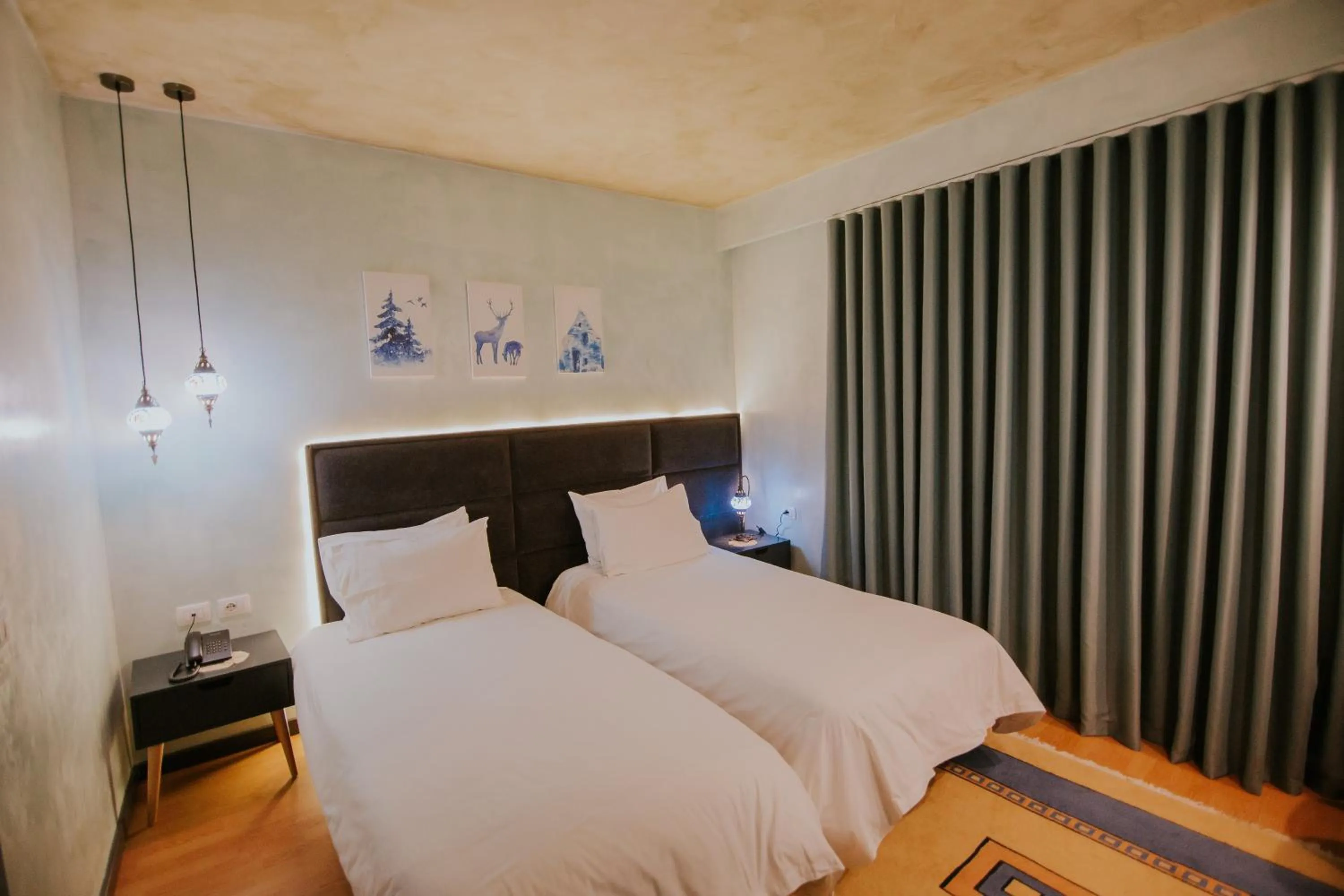 Bed in Dim's Hotel & Restaurant