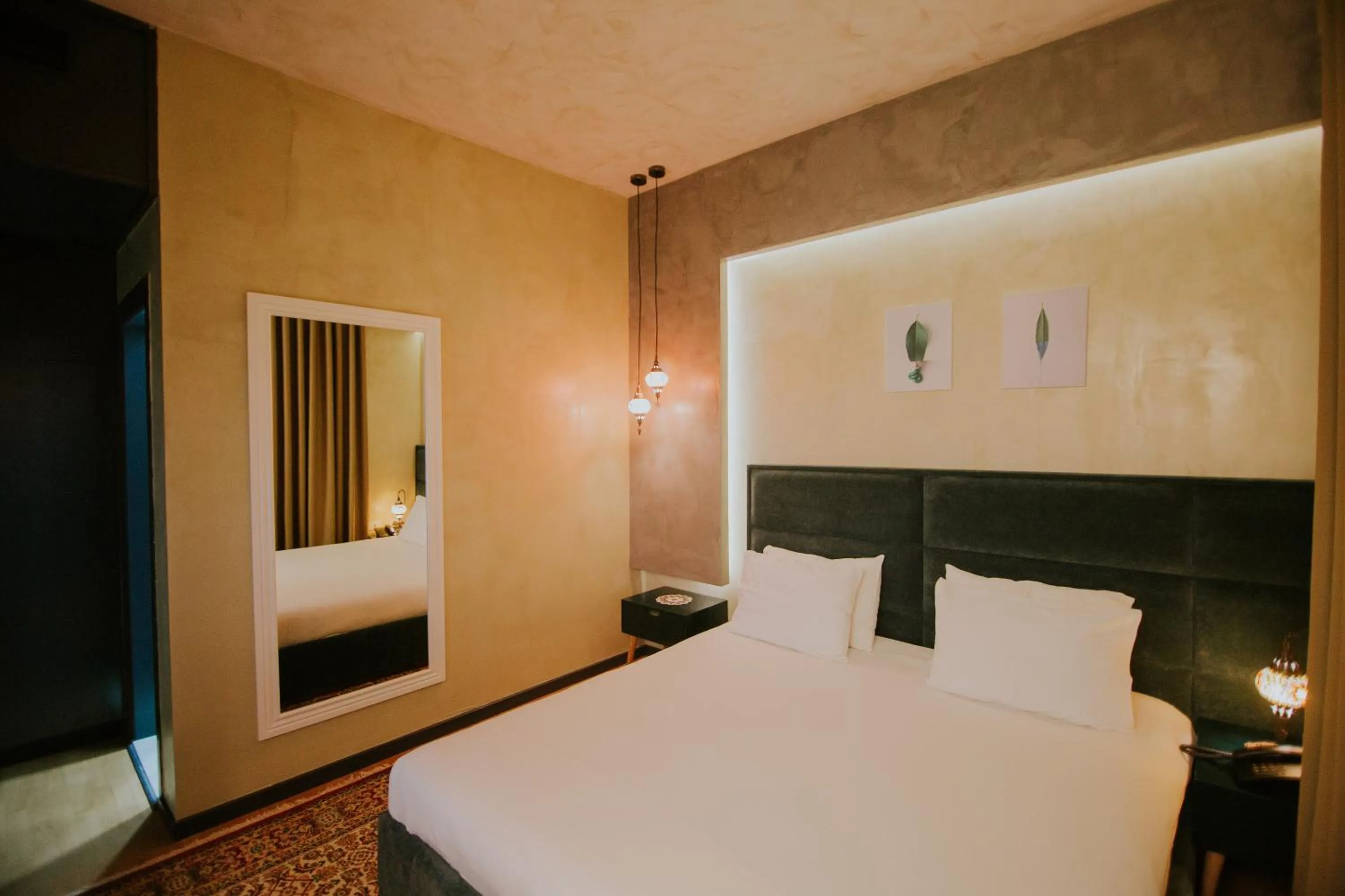 Bed in Dim's Hotel & Restaurant