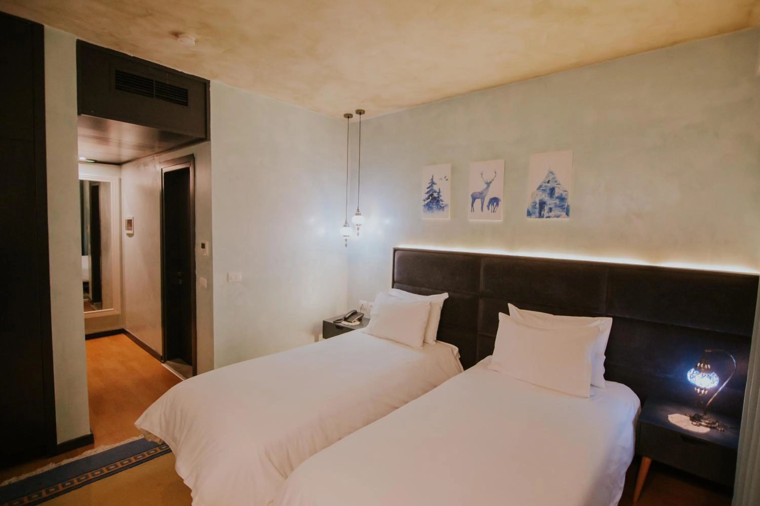 Bed in Dim's Hotel & Restaurant