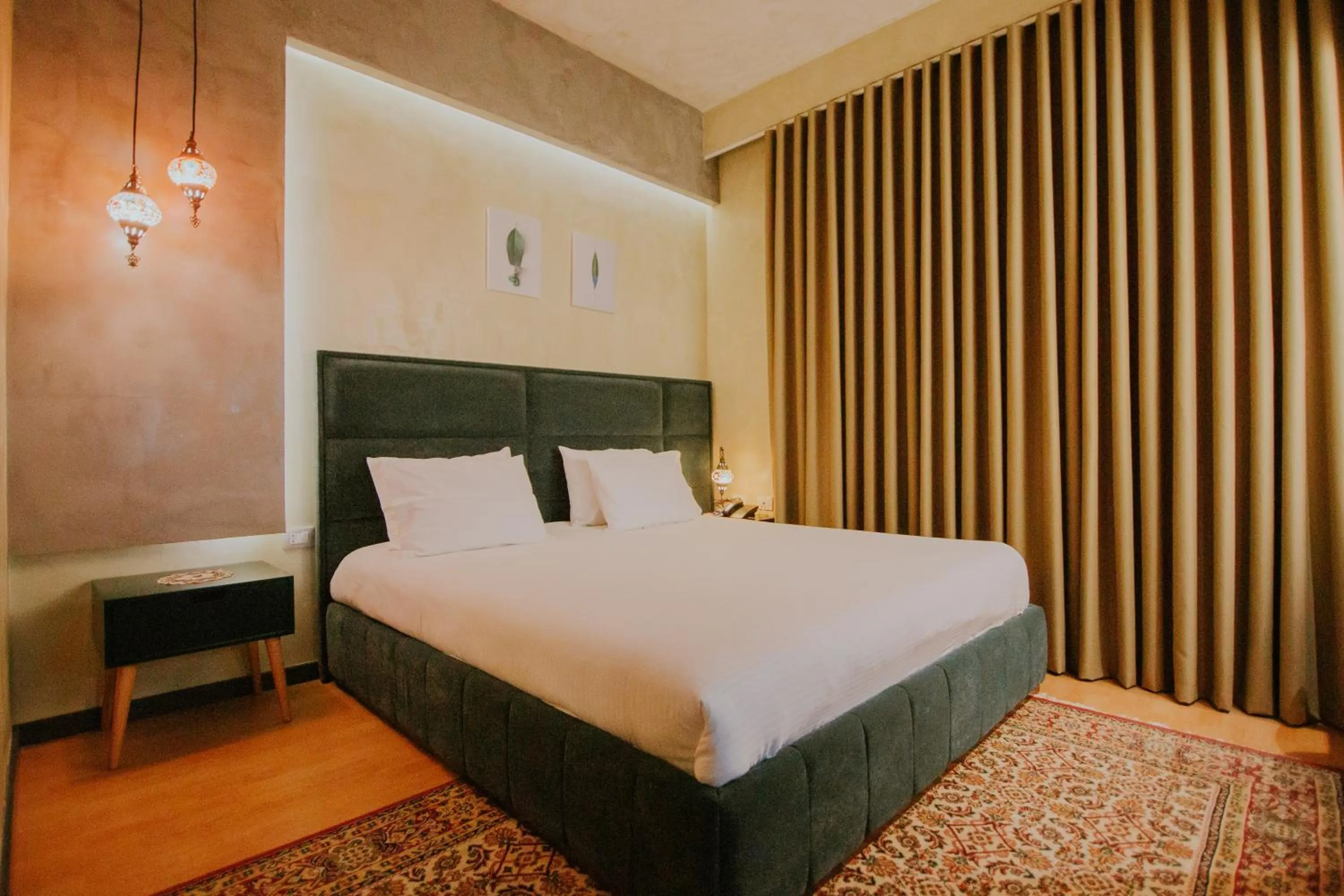 Bed in Dim's Hotel & Restaurant