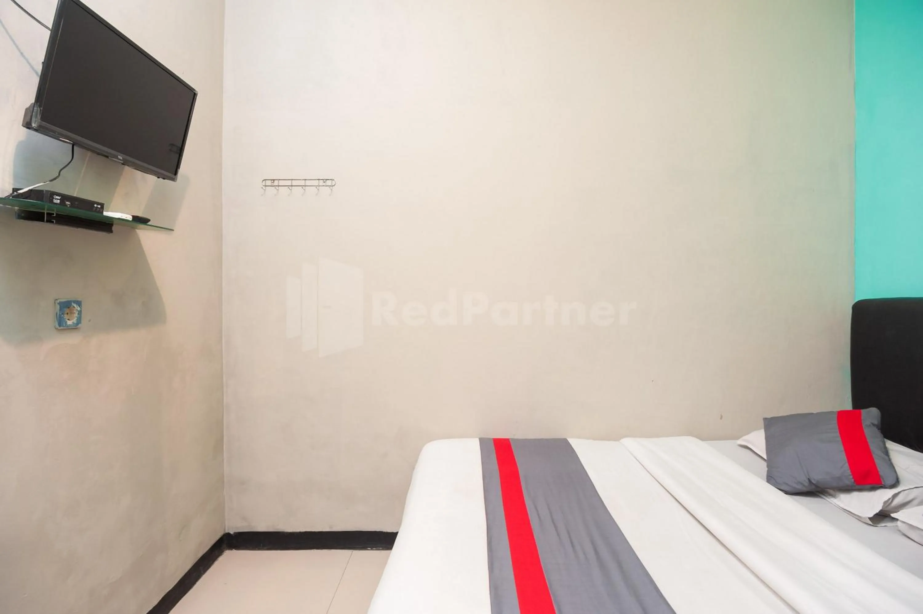 Bed in J&B Rooms Utan Kayu Jakarta Mitra RedDoorz