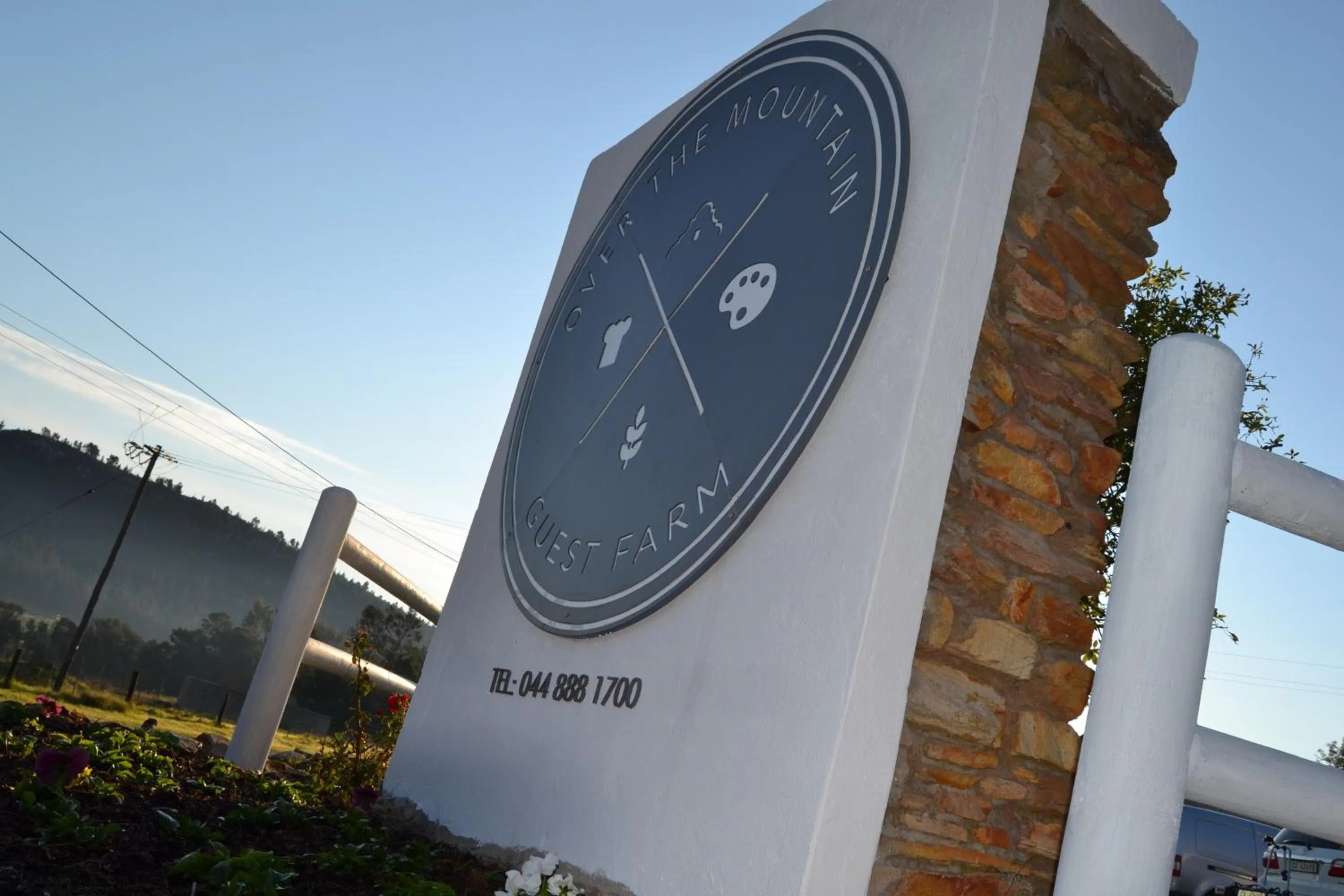 Property logo or sign in Over The Mountain Guest Farm