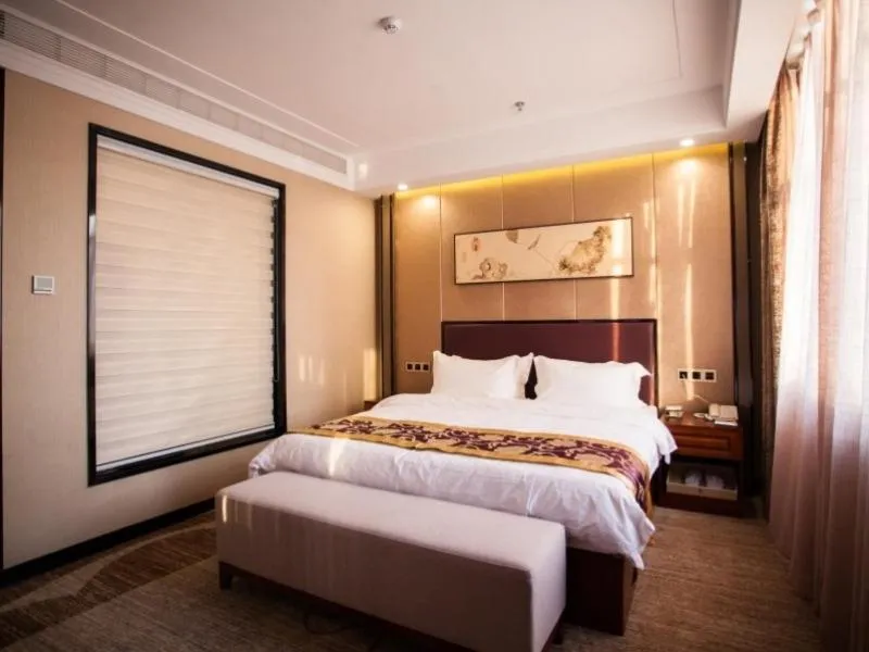 Bed in GreenTree Eastern Bozhou Jingwan Wealth Centre Hotel