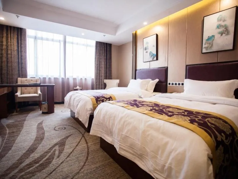 Bed in GreenTree Eastern Bozhou Jingwan Wealth Centre Hotel