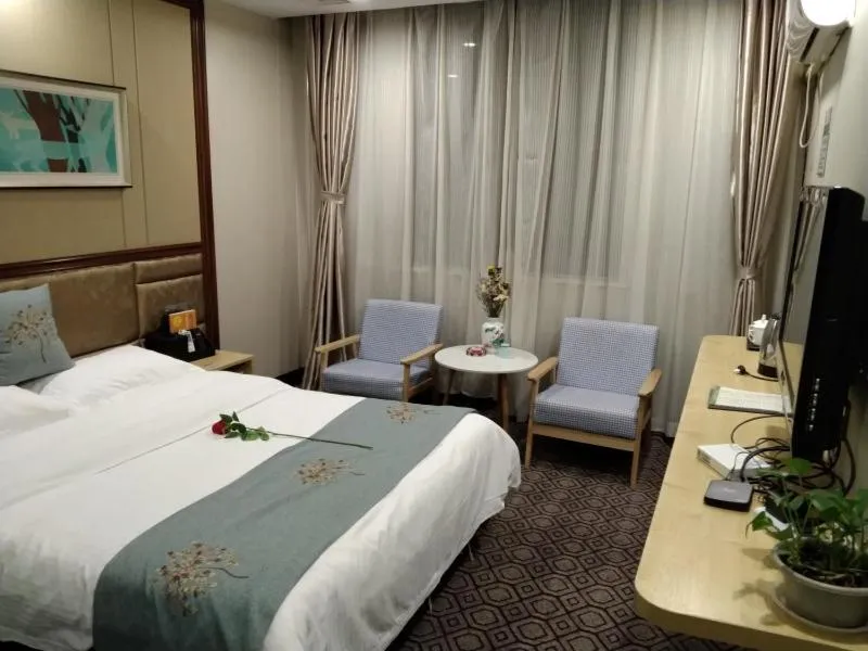 Bed in GreenTree Alliance Xinyang Pingqiao District Nanjing Road Dongyang Hotel