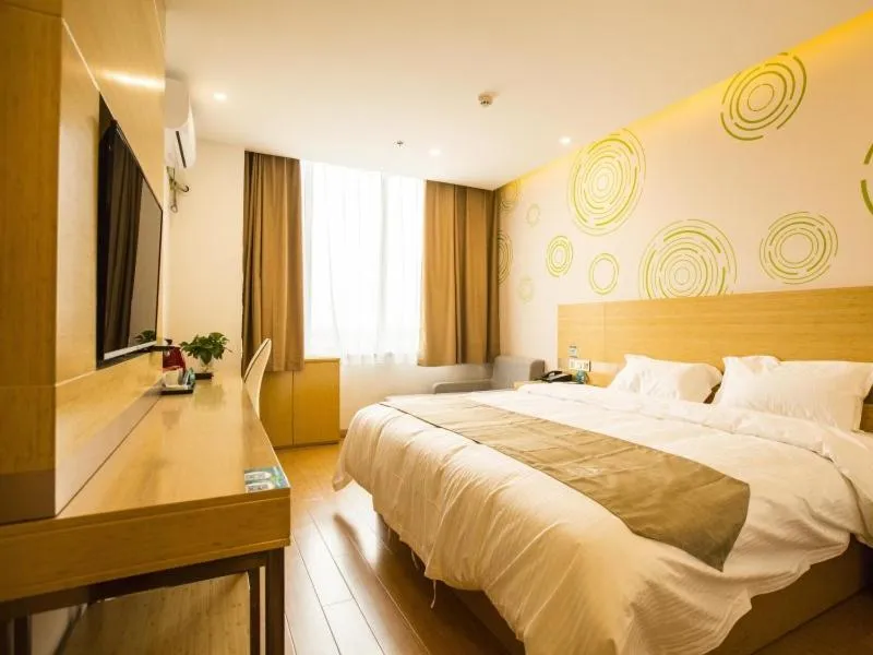 Bed in GreenTree Inn Handan Wei County Xianbiao Business Hotel