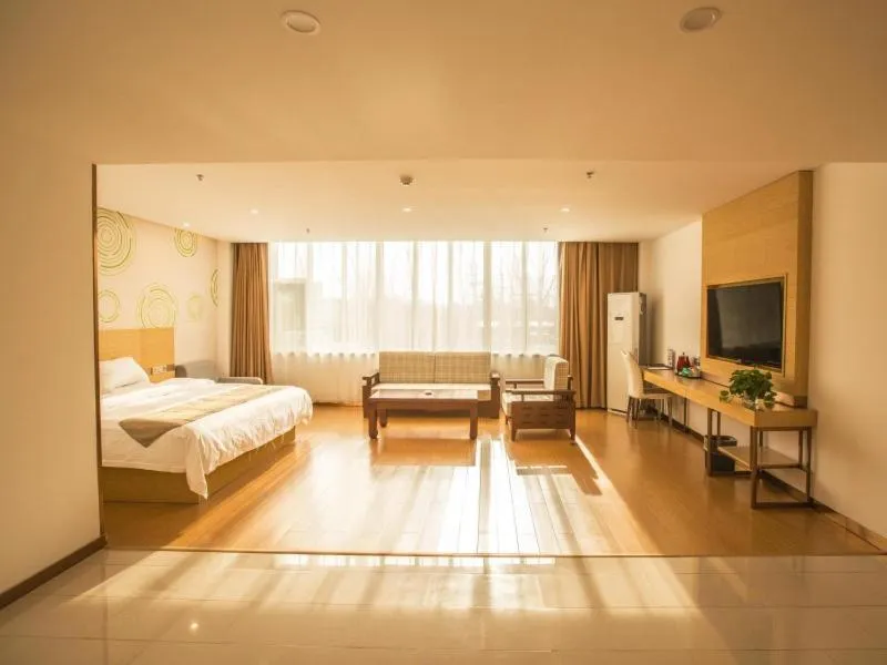 Bed in GreenTree Inn Handan Wei County Xianbiao Business Hotel