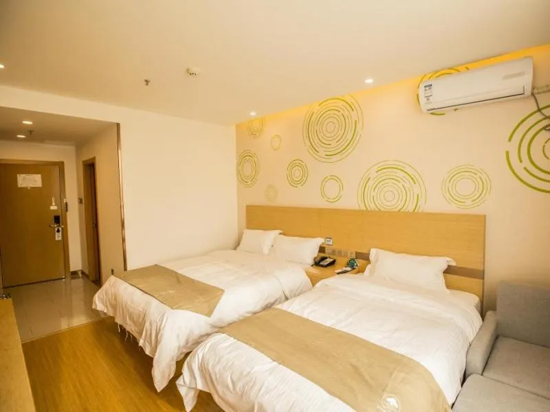Bed in GreenTree Inn Handan Wei County Xianbiao Business Hotel