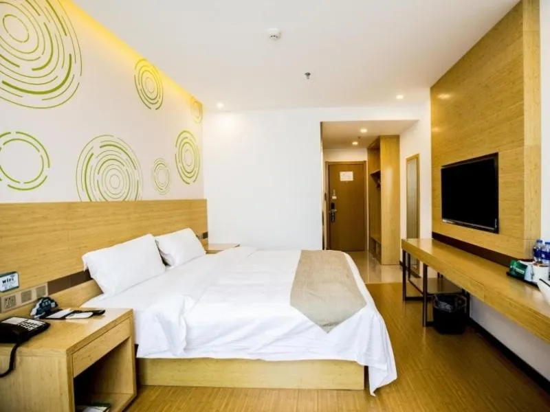 Bed in GreenTree Inn Handan Wei County Xianbiao Business Hotel