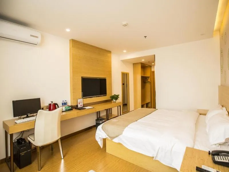 Bed in GreenTree Inn Handan Wei County Xianbiao Business Hotel