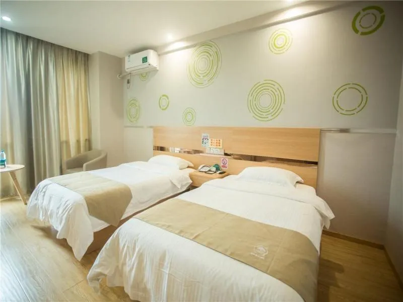 Bed in GreenTree Inn Zhoushan Baiquan Colorful Plaza Express Hotel