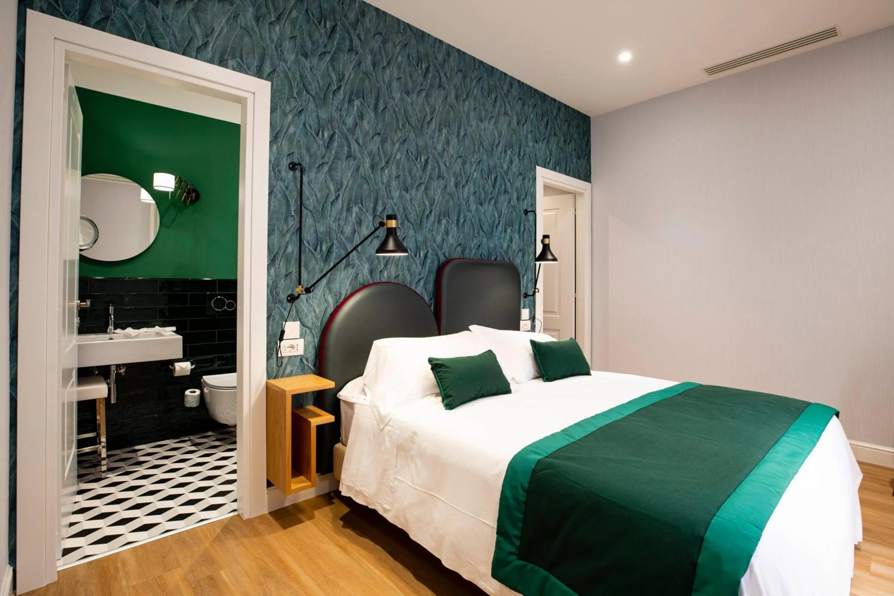 Bed in Vicario Suites