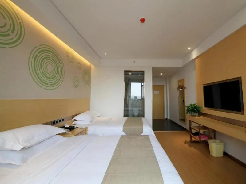 Bed in GreenTree Inn Zhengzhou Gongyi Xinxing Road Business Hotel