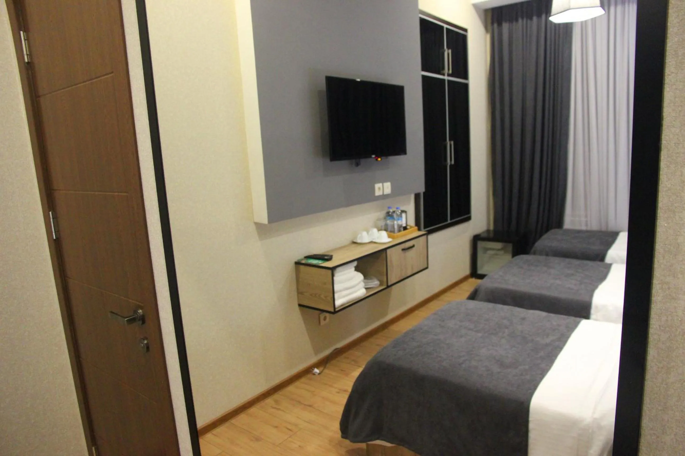 Bed in City Heart Hotel