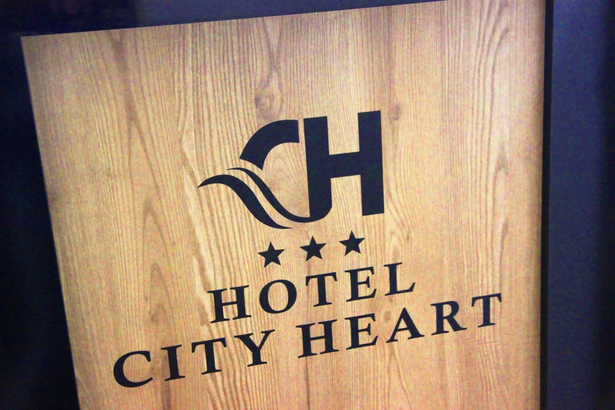 Property logo or sign in City Heart Hotel