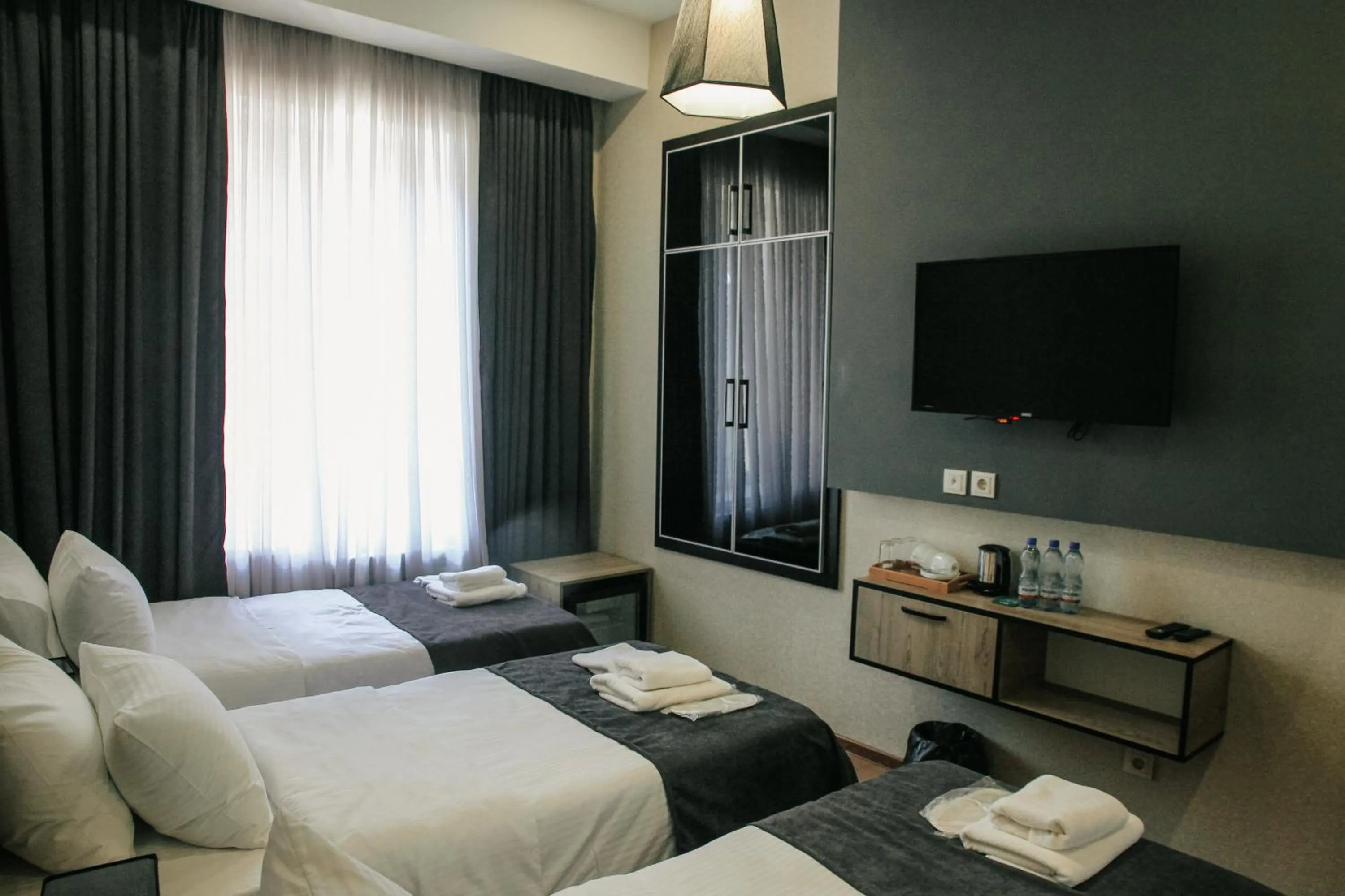 Bed in City Heart Hotel