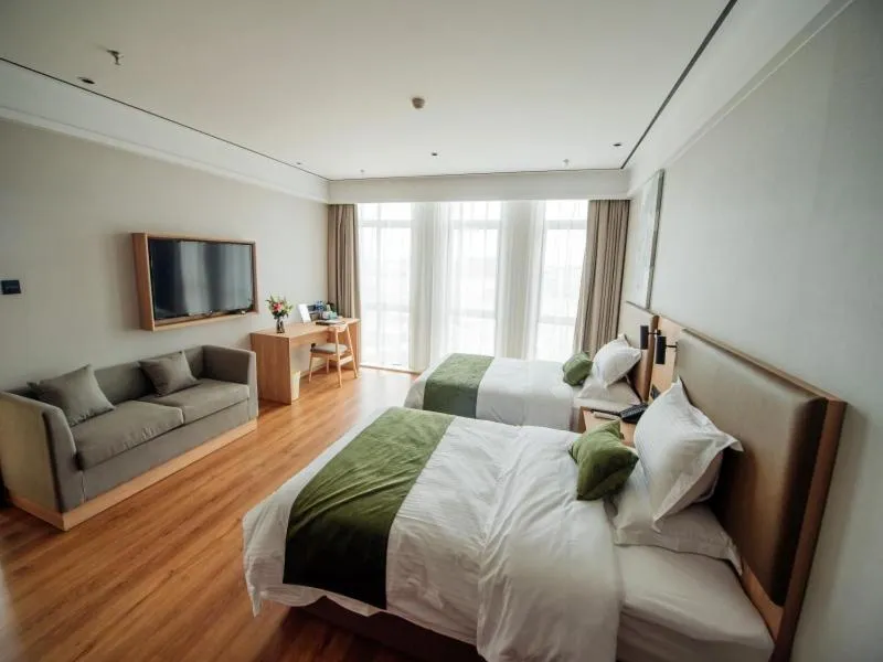 Bed in GreenTree Inn Taizhou Xinghua City Zhouzhuang Town Business Hotel