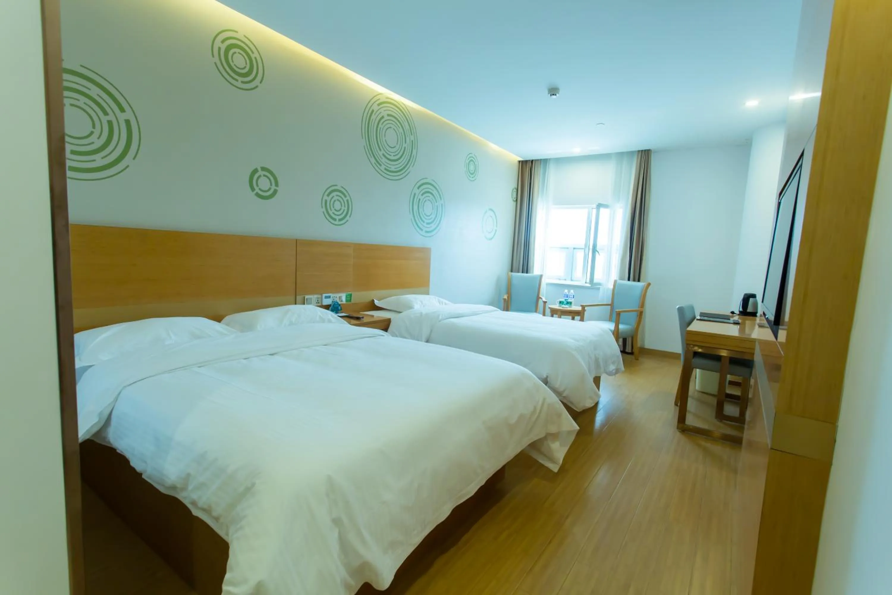 Bed in GreenTree Inn Yangzhou Railway Station Jinzhankou Business Hotel