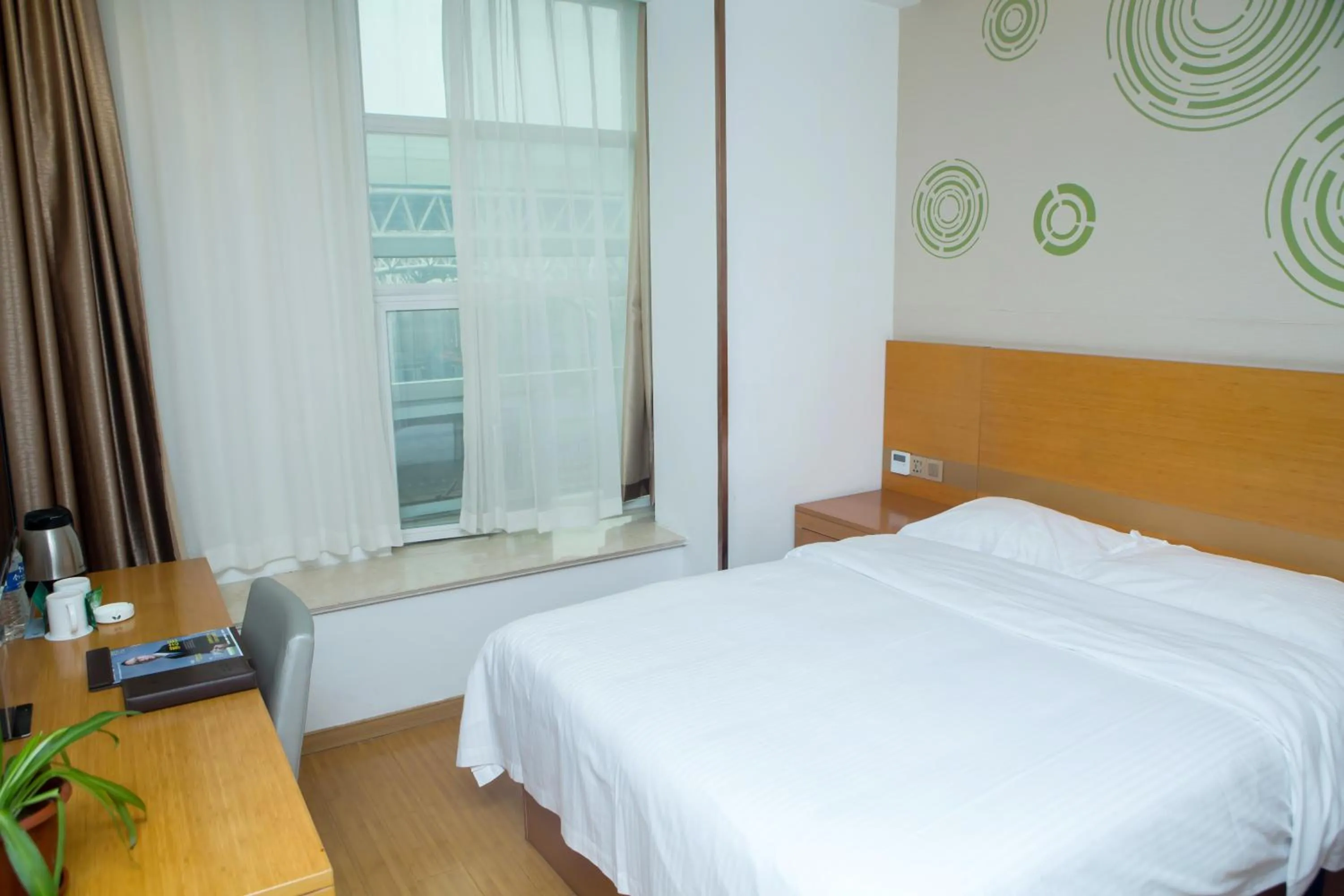 Bed in GreenTree Inn Yangzhou Railway Station Jinzhankou Business Hotel