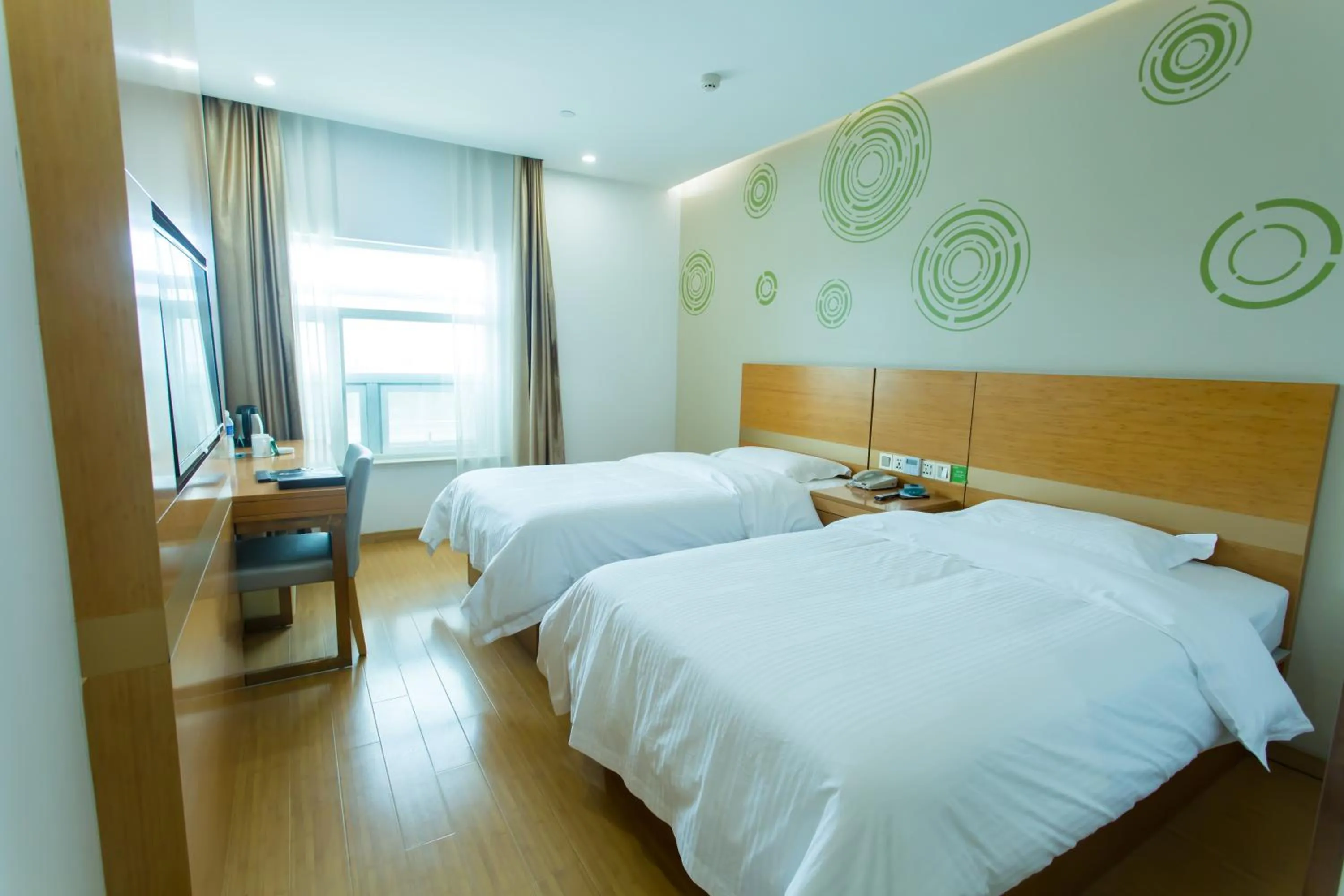 Bed in GreenTree Inn Yangzhou Railway Station Jinzhankou Business Hotel