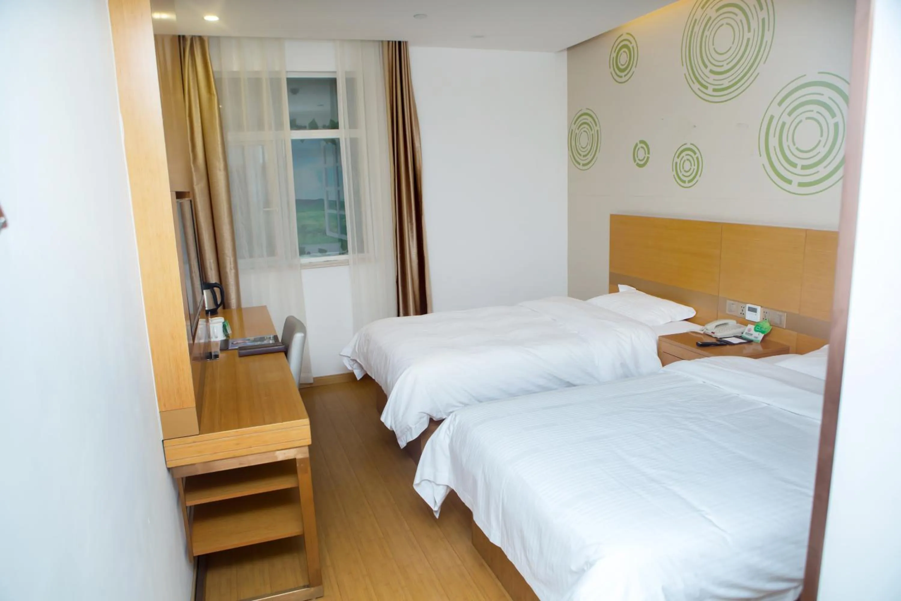 Bed in GreenTree Inn Yangzhou Railway Station Jinzhankou Business Hotel