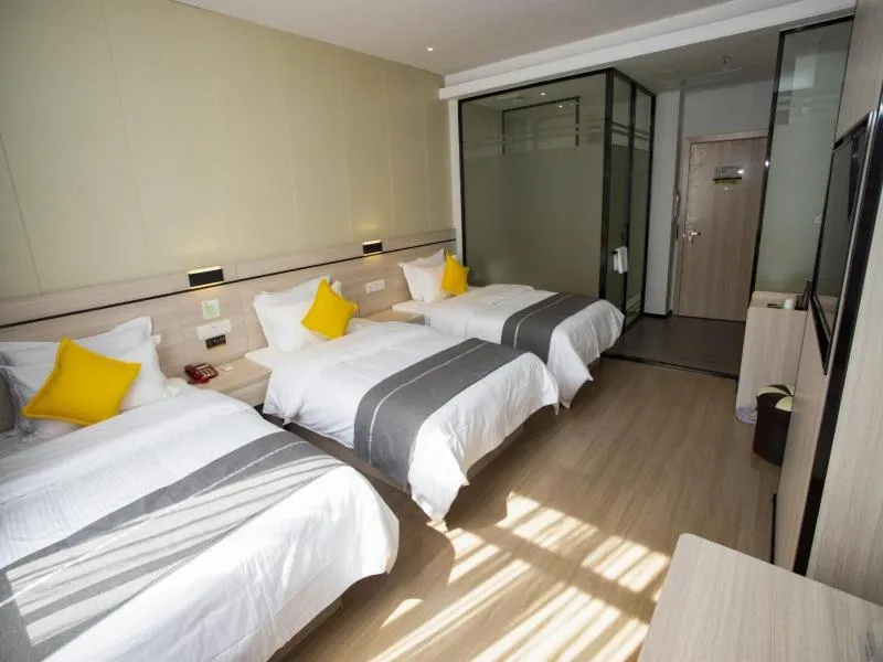 Bed in GreenTree Inn Yulin Exhibition Center Darunfa Hotel