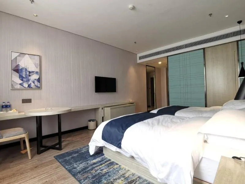 Bed in GreenTree Eastern Lianyungang Jiaruibao Plaza Hotel