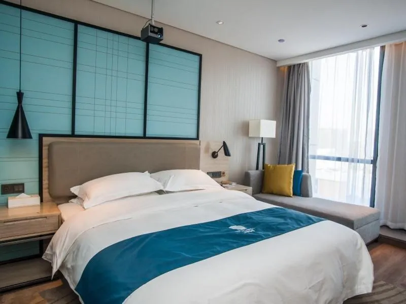 Bed in GreenTree EasternLianyungang Wanda Plaza Hotel