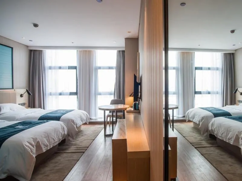 Bed in GreenTree EasternLianyungang Wanda Plaza Hotel