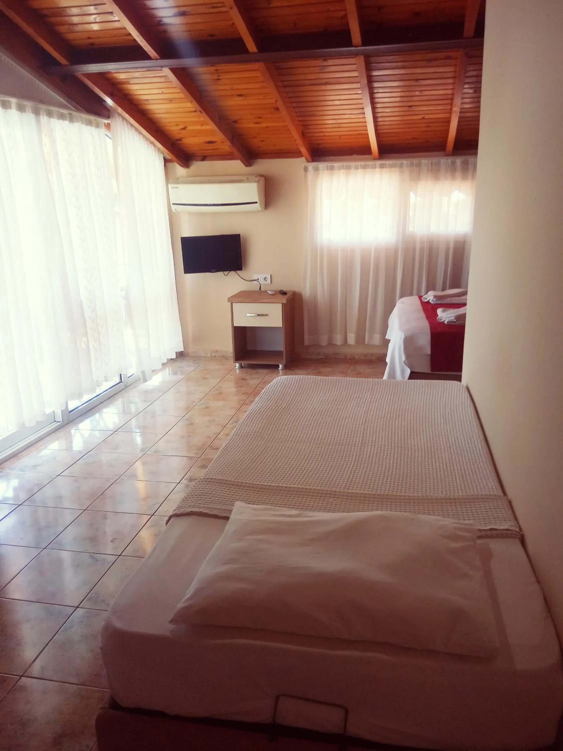 Bed in Dove Apart Hotel