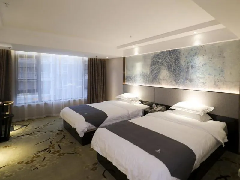 Bed in GreenTree Eastern Jingde Town Railway Station Hotel