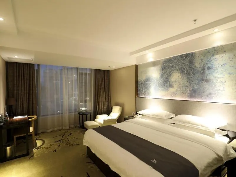 Bed in GreenTree Eastern Jingde Town Railway Station Hotel