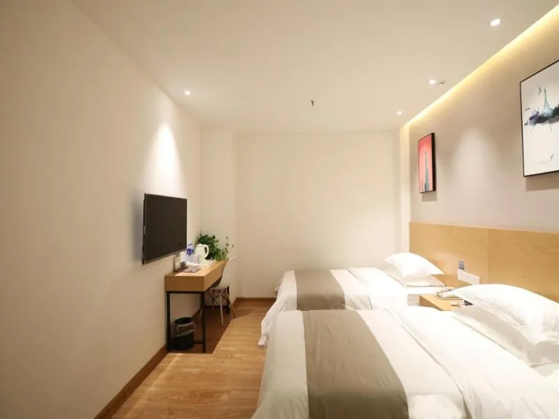 Bed in Shell Xinzheng Airport Port Huaxia Avenue Hotel