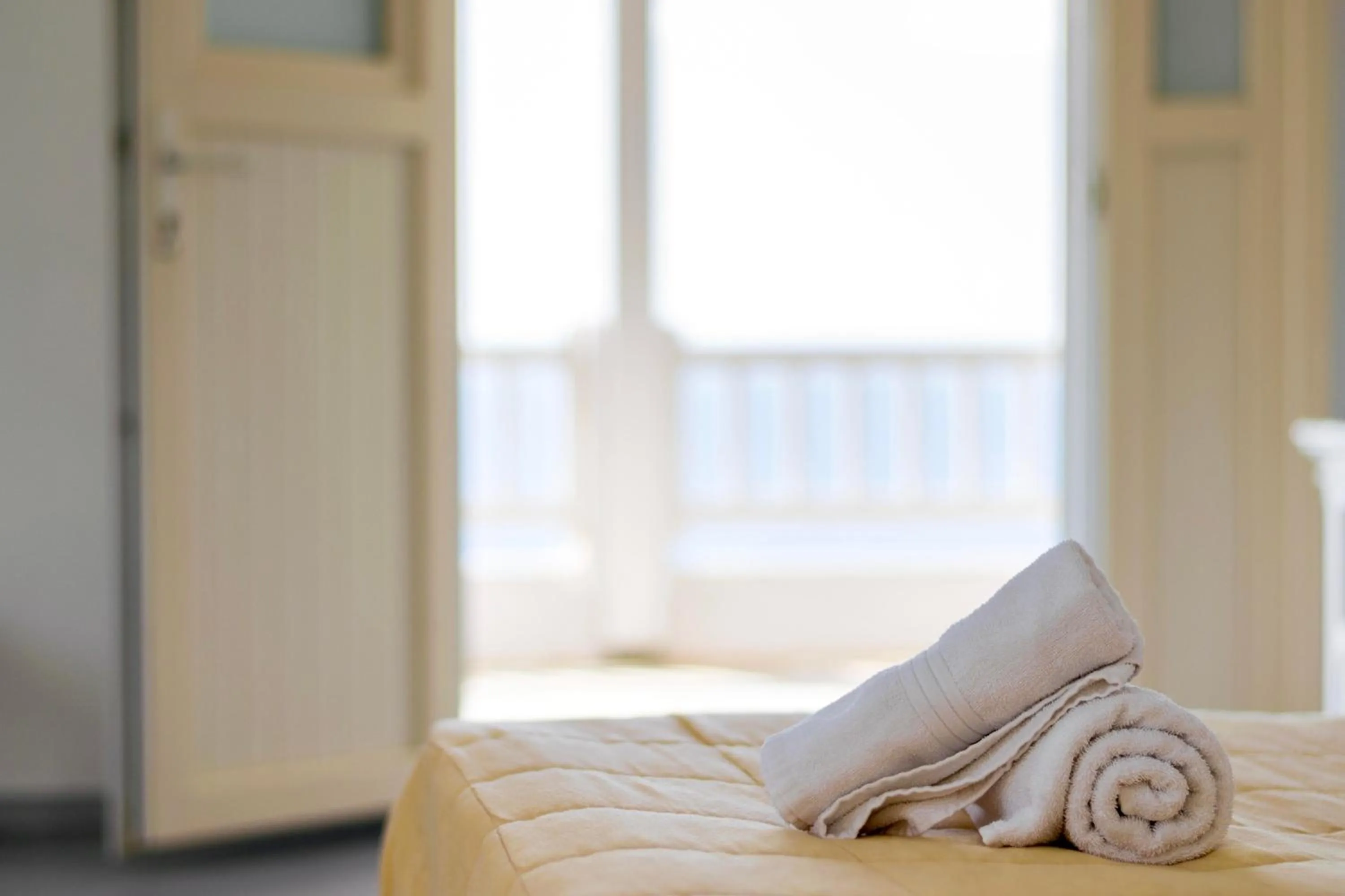 Bed in With-inn Mykonos Suites