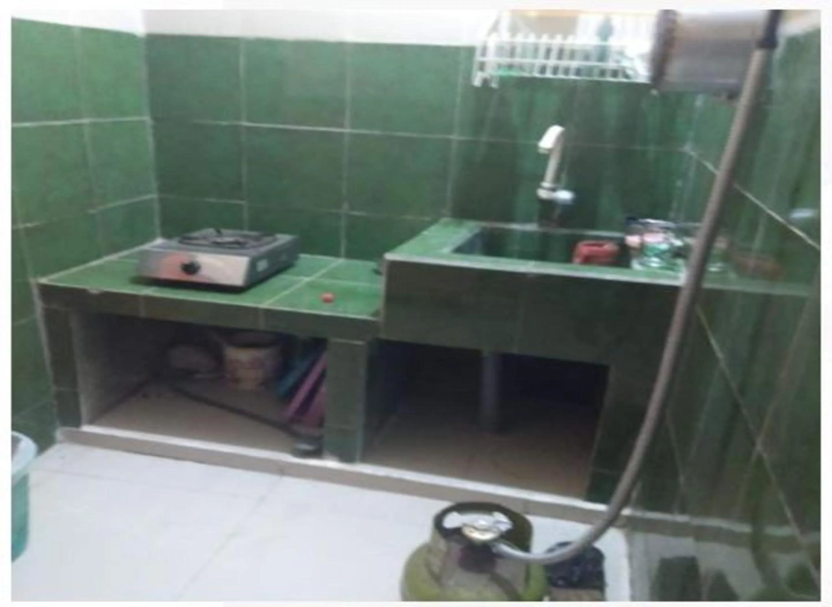 Kitchen or kitchenette in Penginapan Indah Lestari