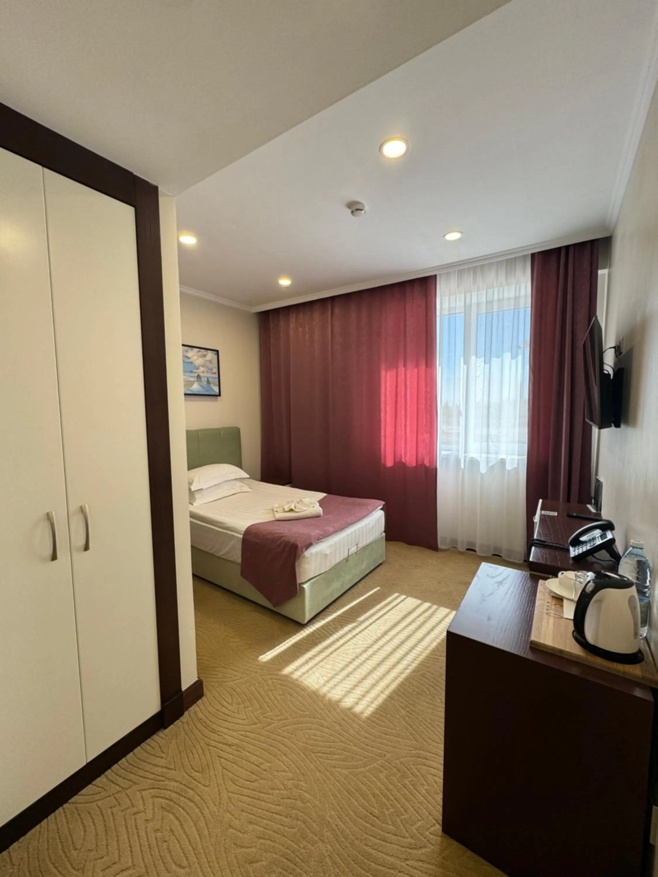 Bed in SULO Atyrau Hotel