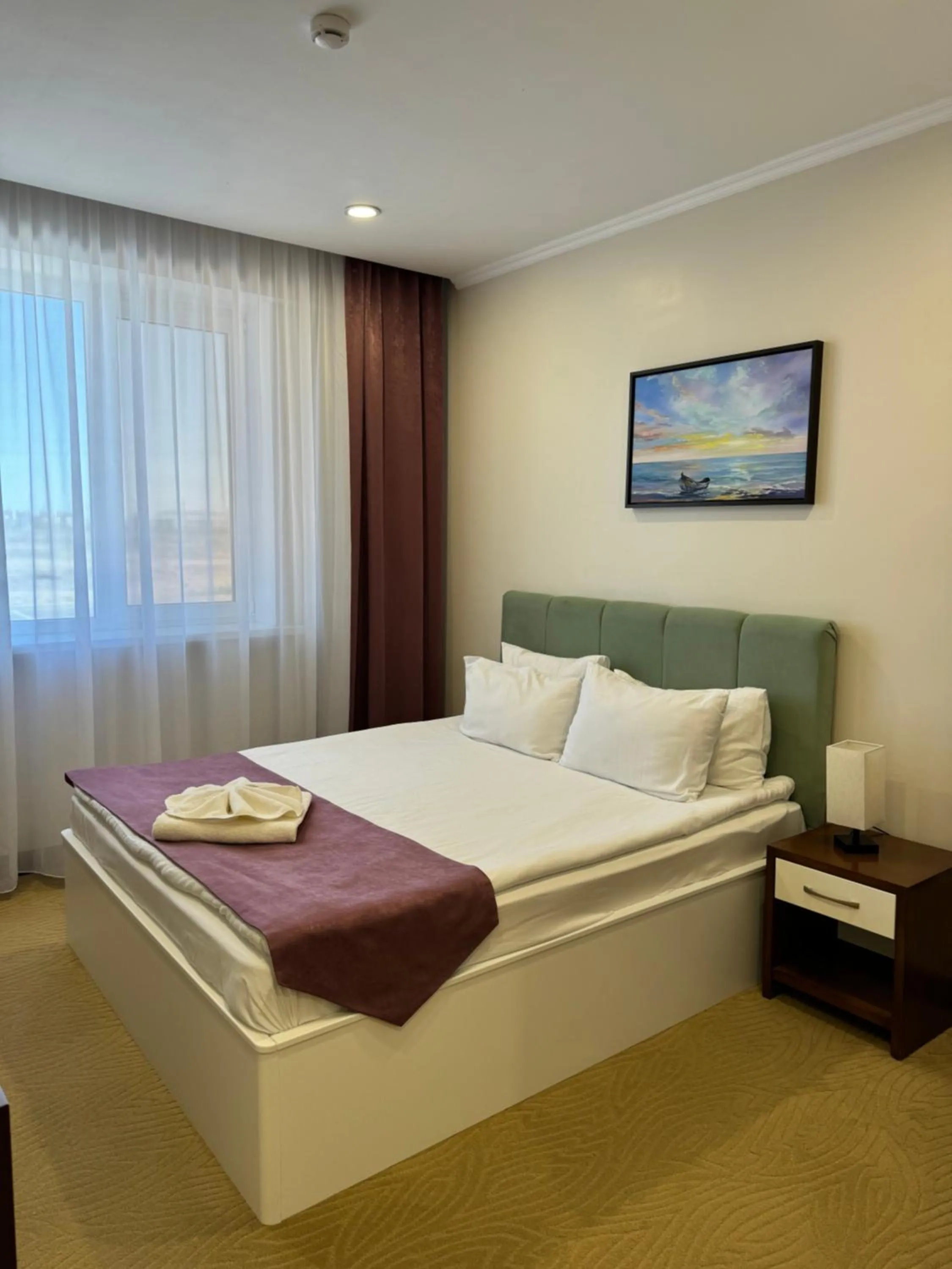 Bed in SULO Atyrau Hotel