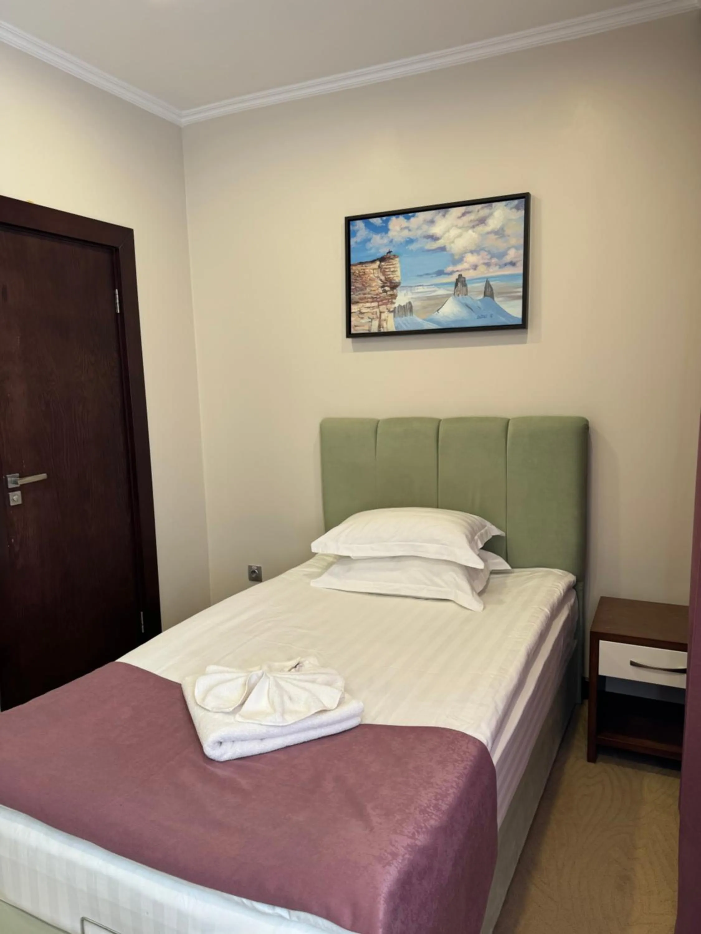 Bed in SULO Atyrau Hotel