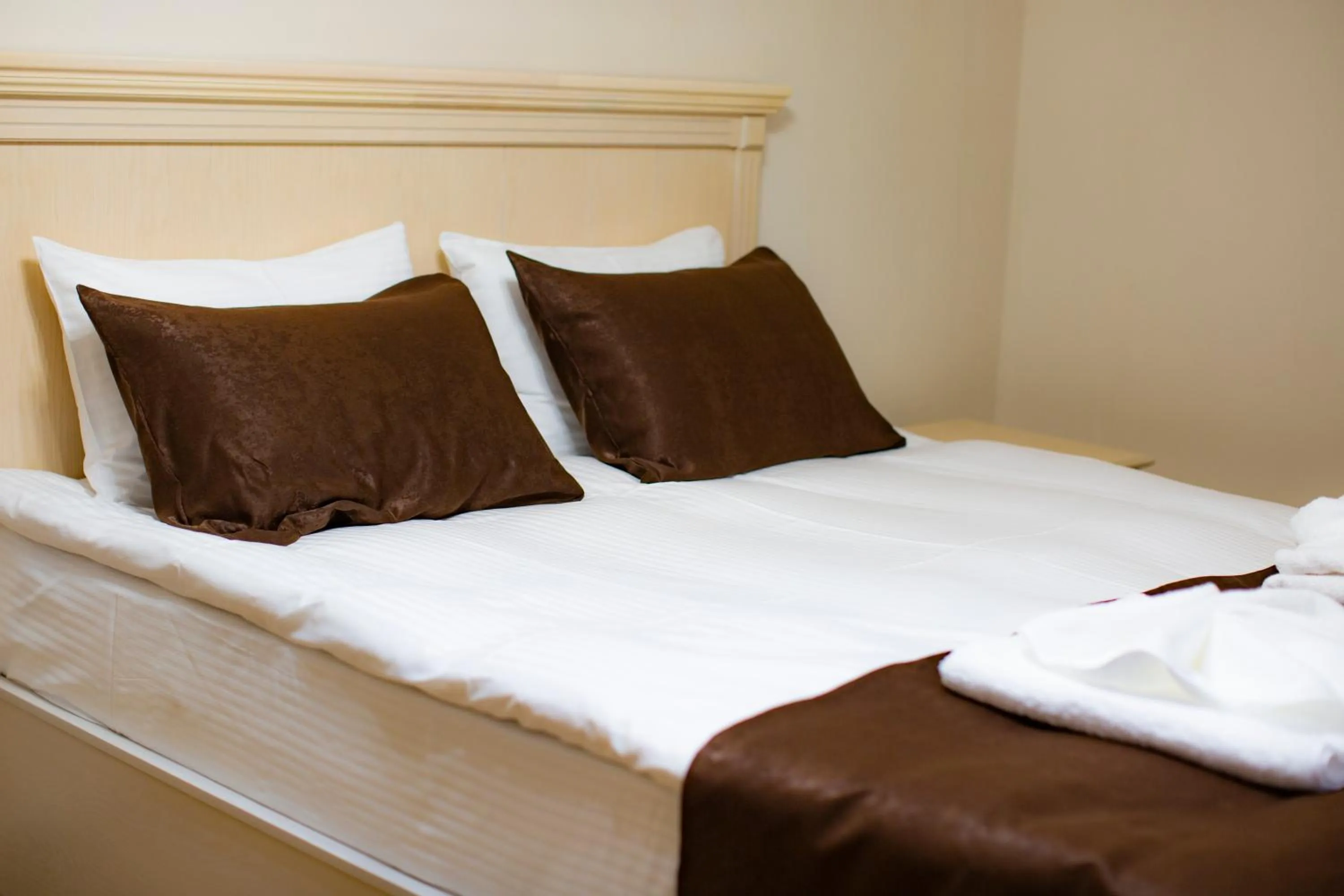 Bed in SULO Atyrau Hotel