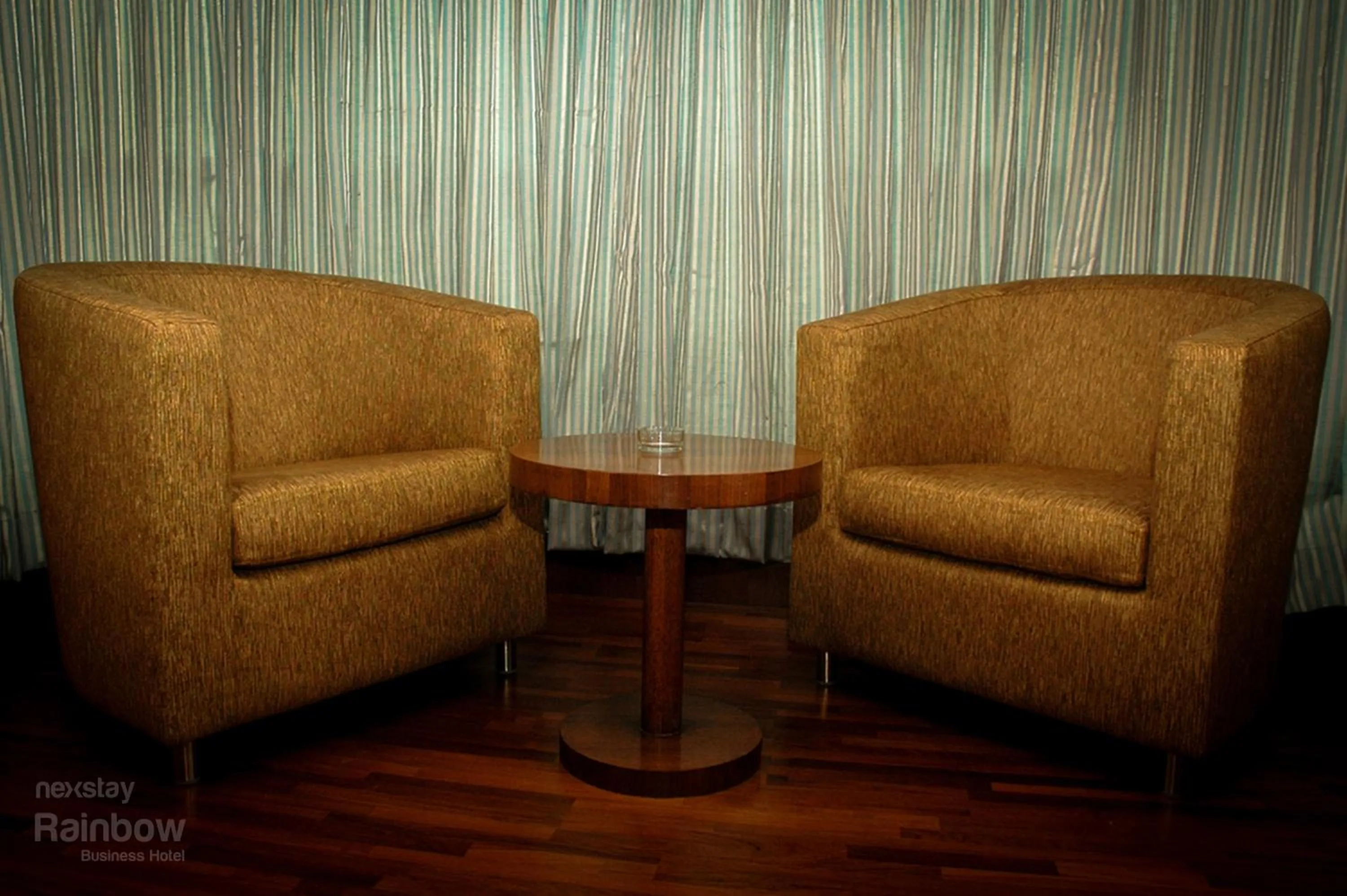 Seating area in New Rainbow Business Hotel