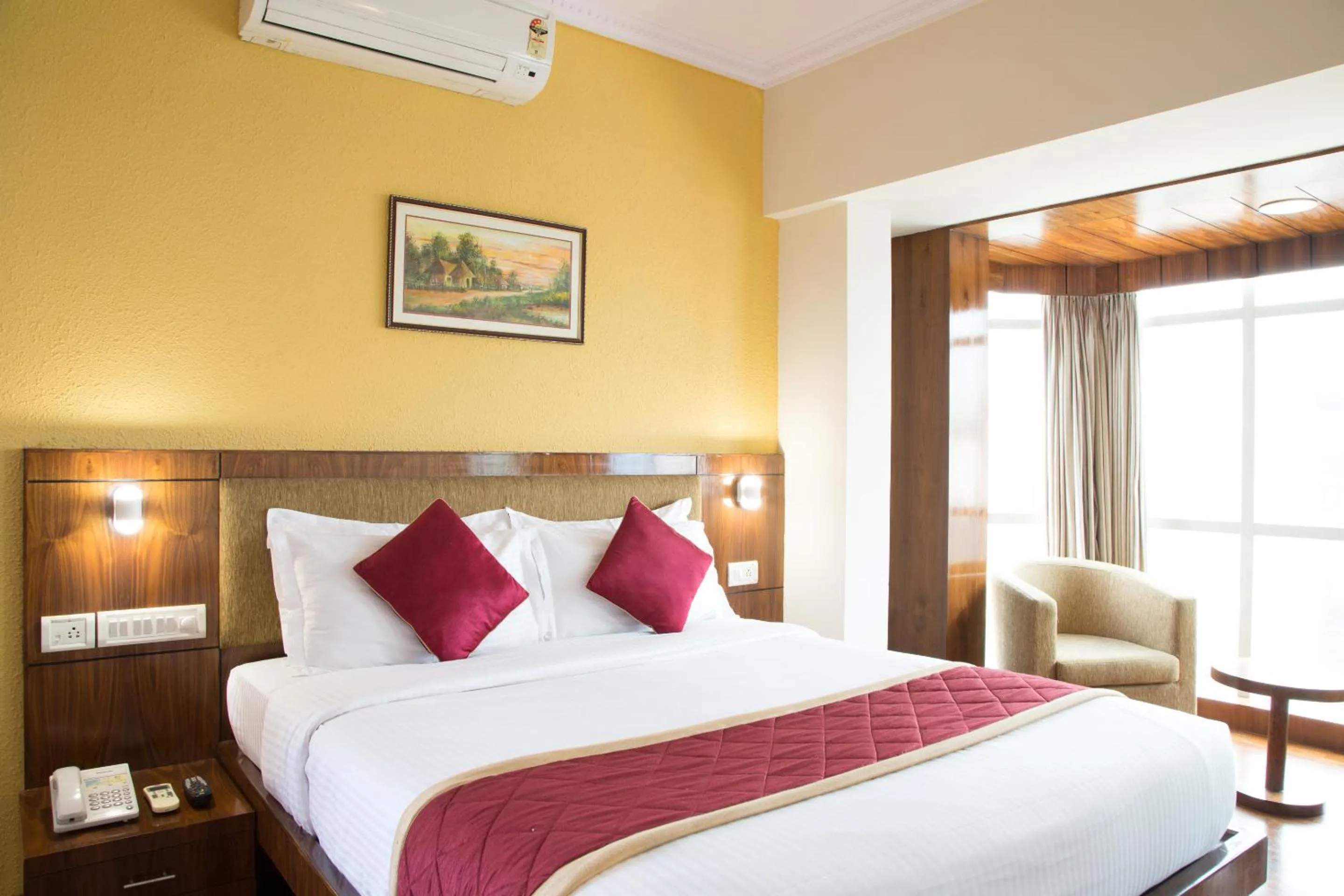 Bed in New Rainbow Business Hotel